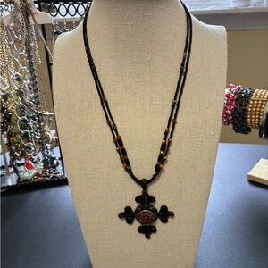 Elegant Vintage Chico’s Black and Brown Beaded Necklace with Cross Pendant.
